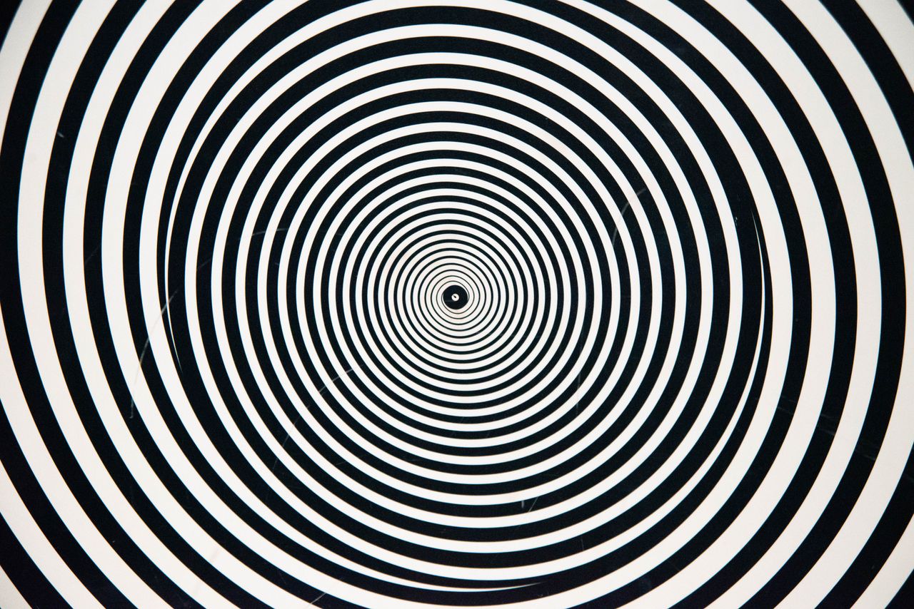 Hypnotic black and white concentric circles forming a captivating, optical illusion design.